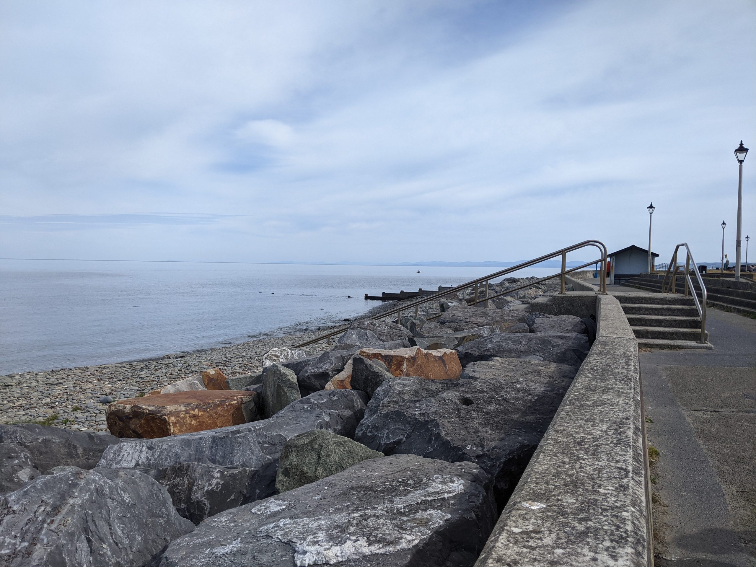 Concrete promenade along seafront with rock defences.